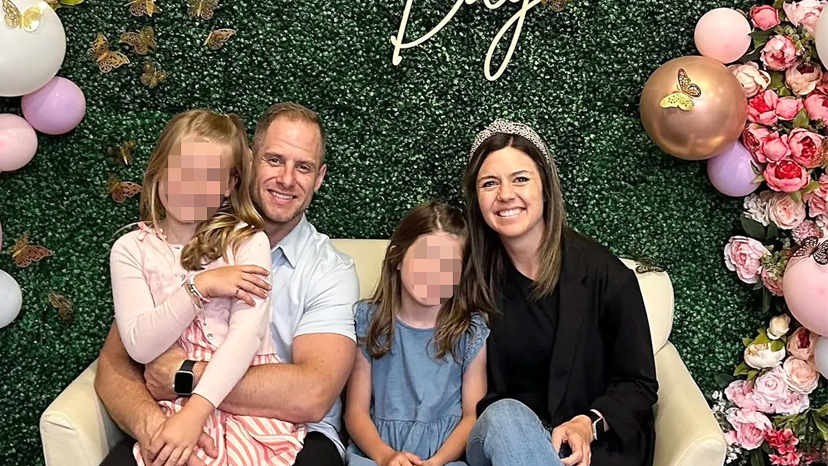 Ashley and Caleb Flynn in an undated photo with their two children.