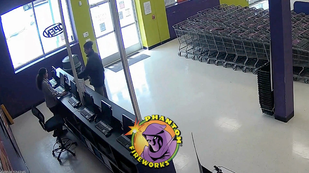 Emir Balat at the front counter of a fireworks store