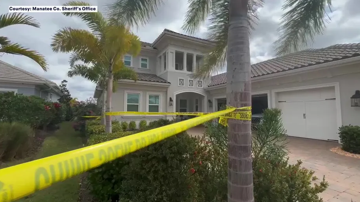 Crime scene tape surrounds an upscale Lakewood Ranch, Florida home.
