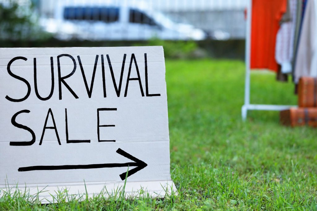 prepping on a budget survival sale sign